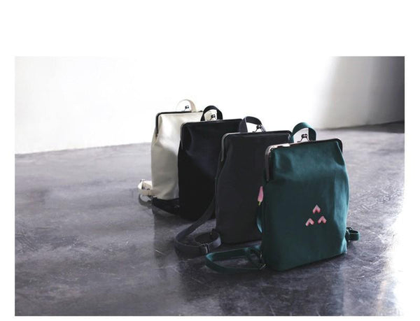 Canvas backpack with metal frame clasp  - 3 Triangles | Flamingolandia